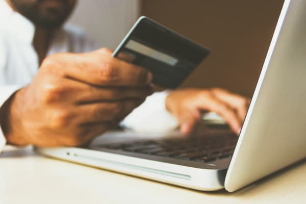 entering bank card details on the laptop