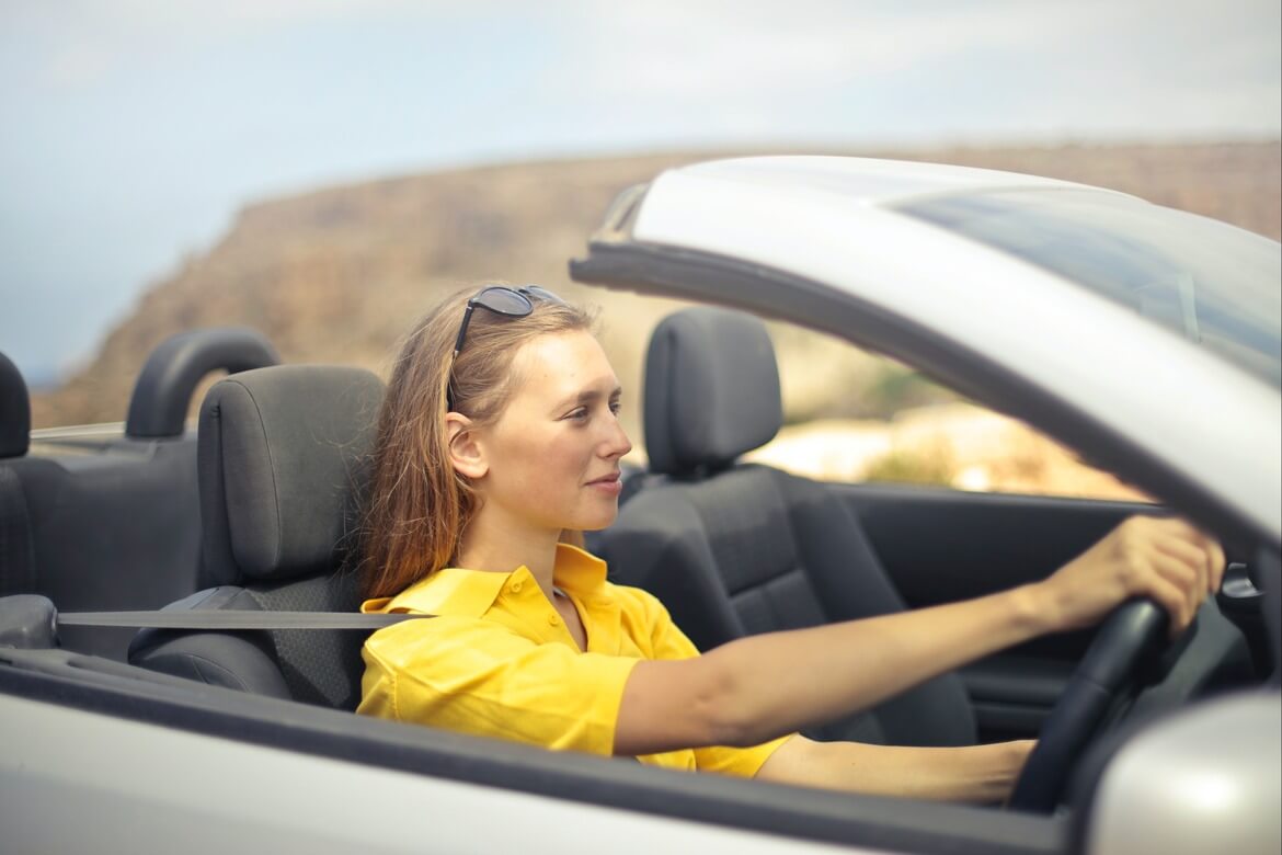 Woman Driving a Summer Lease Car